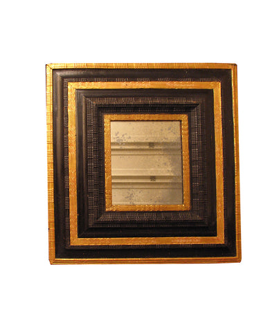 ITALIAN BAROQUE EBONIZED AND PARCEL GILT MIRROR