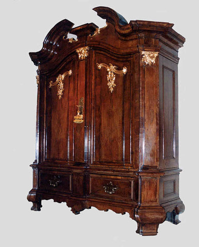 NORTH GERMAN ROCOCO WALNUT  AND PARCEL GILT CUPBOARD