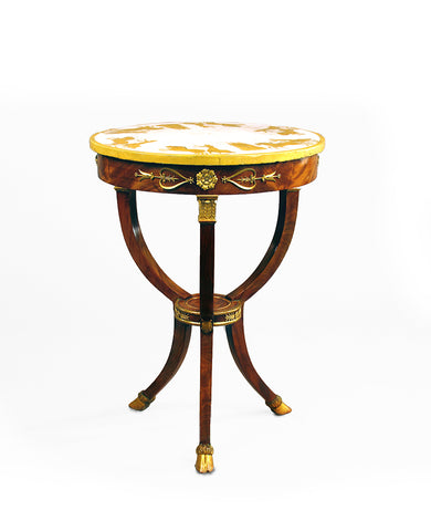 ITALIAN EMPIRE GILT METAL MOUNTED MAHOGANY AND PARCEL GILT GUERIDON