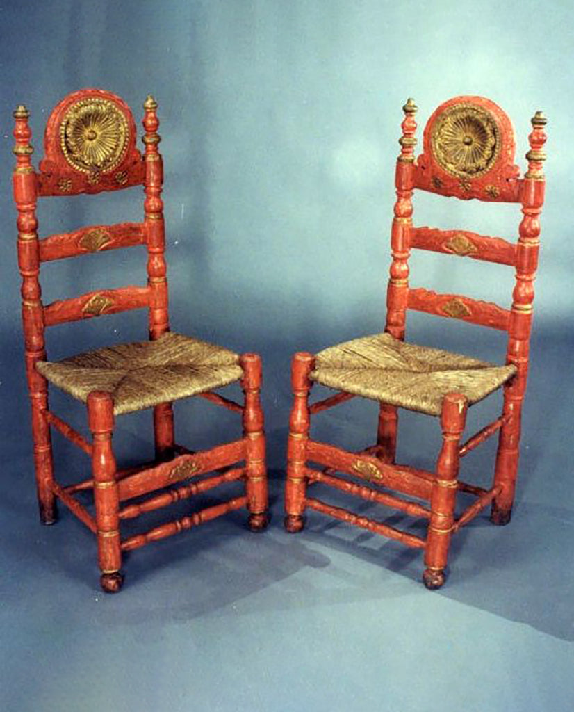 SET OF FOUR IBERIAN BAROQUE  RED PAINTED LADDERBACK CHAIRS